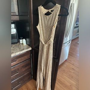 Sparkly  gold pant suit sleeveless size 4-6 like new.